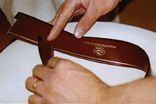 Fitting a sweatband in a Panama hat