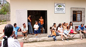 People wait at the Medical Clinic in Pile
